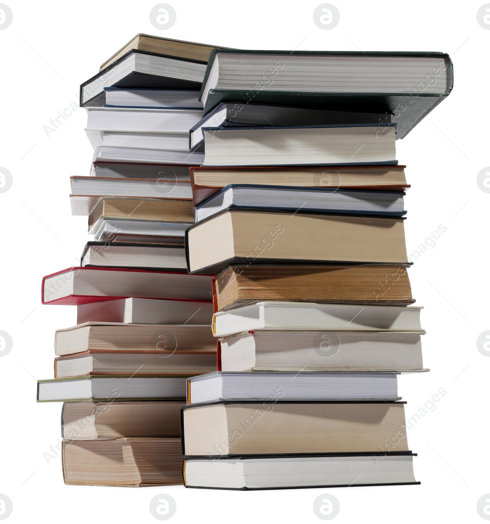 Photo of Stacks of many different books isolated on white