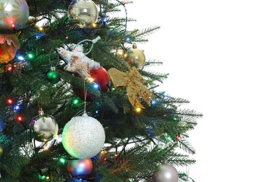 Photo of Christmas tree with beautiful decorations on white background, closeup