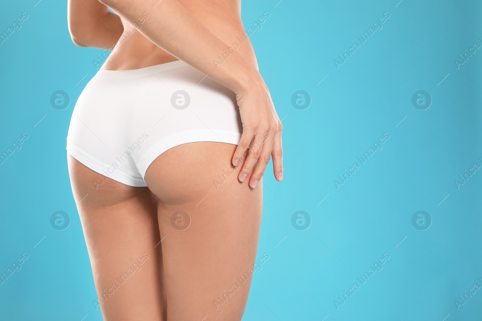 Photo of Young woman with slim body on color background, closeup. Space for text