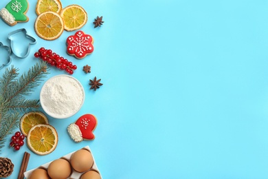 Photo of Flat lay composition with Christmas cookies and flour on light blue background. Space for text