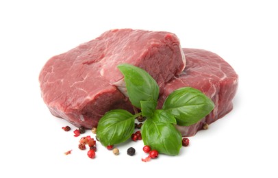 Photo of Fresh beef meat with basil leaves and spices isolated on white