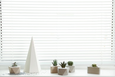 Photo of Window with blinds and potted plants on sill, space for text