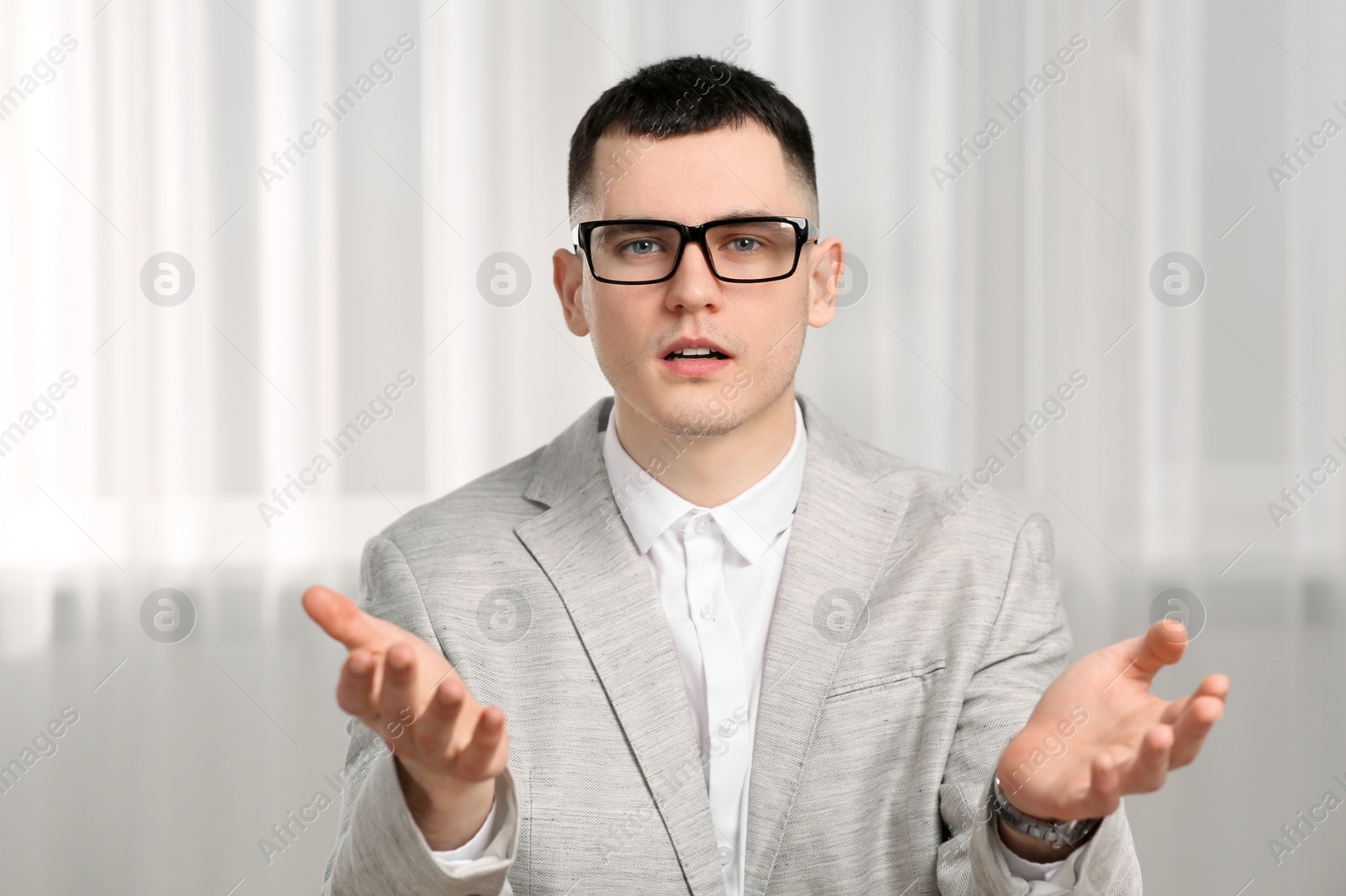 Photo of Young man having online video call indoors, view from web camera