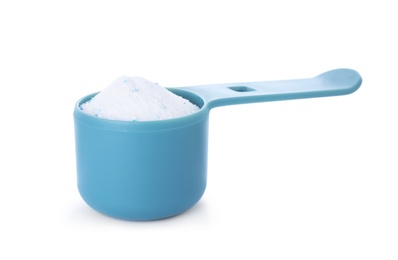 Photo of Laundry detergent in plastic measuring scoop on white background