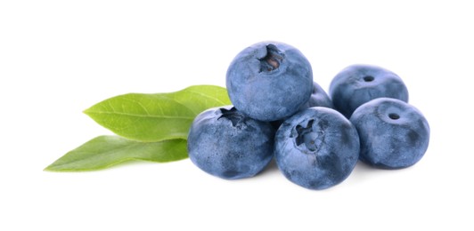 Photo of Pile of tasty fresh ripe blueberries and green leaves on white background
