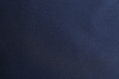 Photo of Texture of dark blue fabric as background, closeup