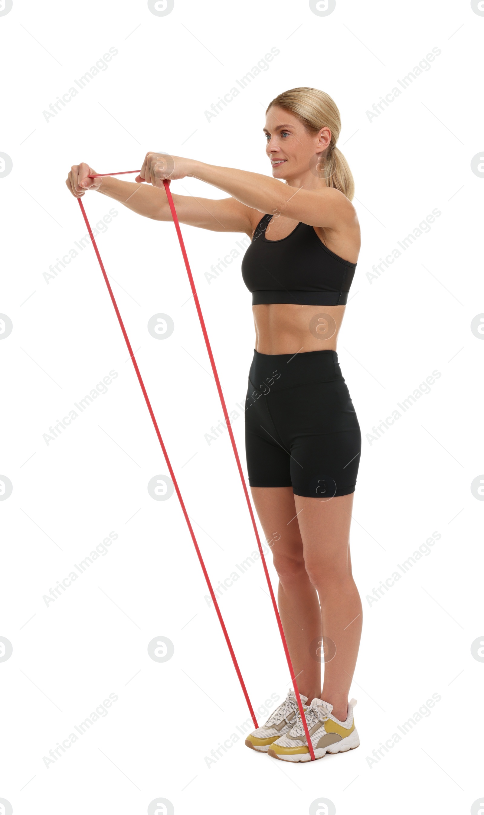 Photo of Woman exercising with elastic resistance band on white background