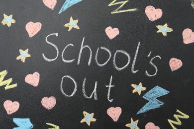Photo of Words School's Out and pictures on blackboard. Summer holidays