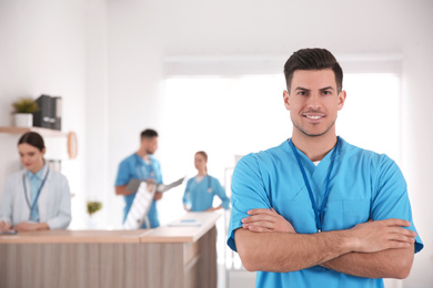 Portrait of male doctor in modern clinic