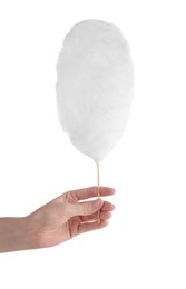 Woman holding sweet cotton candy on white background, closeup