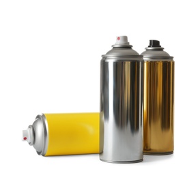 Photo of Cans of different spray paints on white background