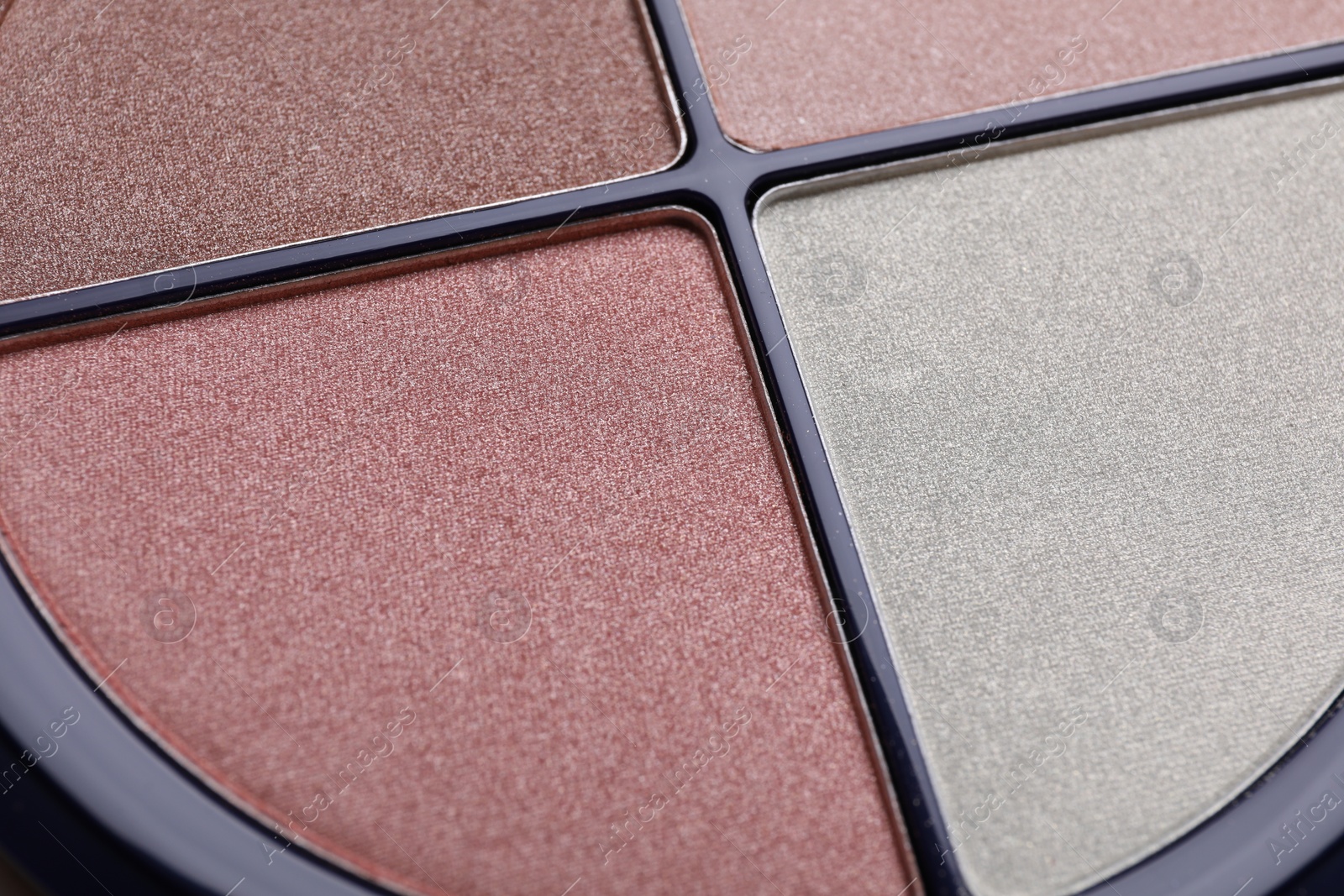 Photo of Colorful contouring palette as background, closeup. Professional cosmetic product