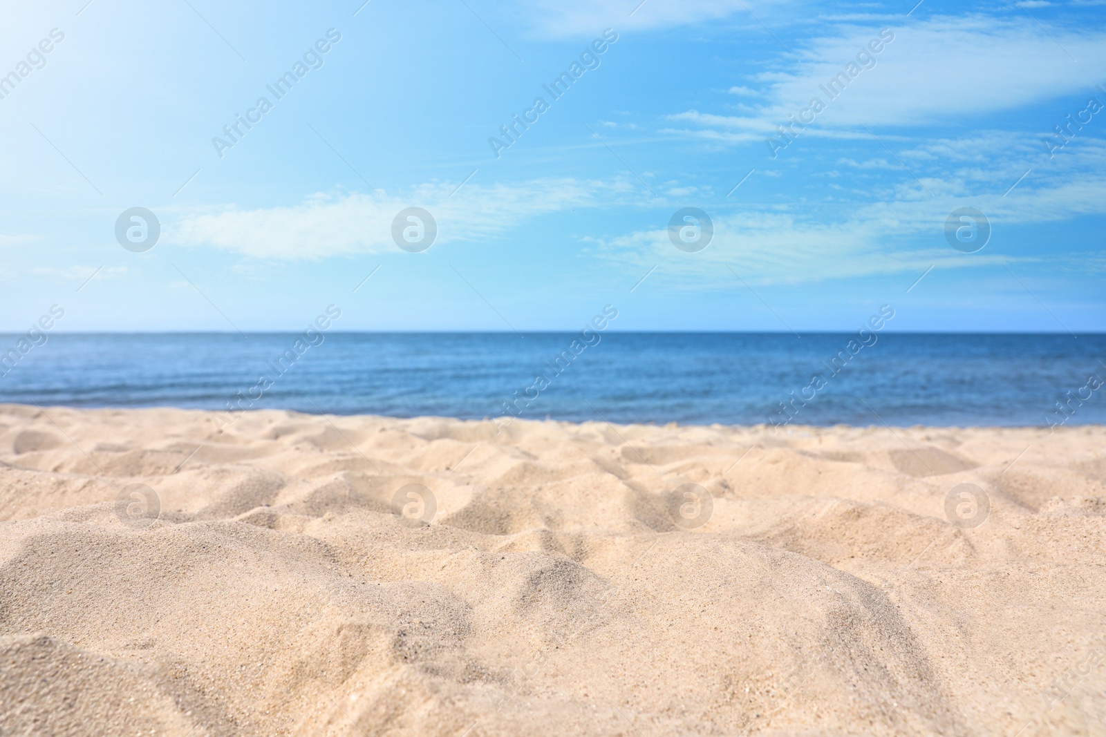 Photo of Sandy beach near sea on sunny day