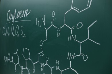 Photo of Chemical formulas written with chalk on green board