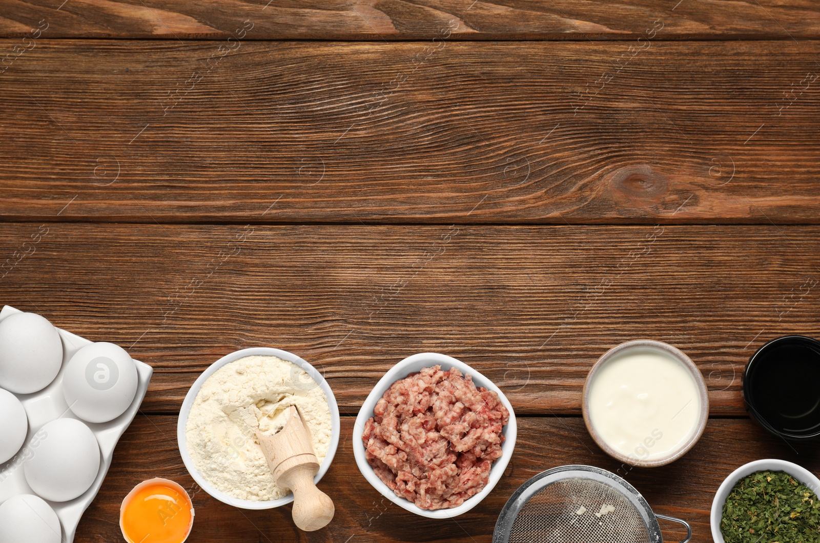 Photo of Different products on wooden table, flat lay. Space for text