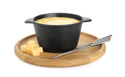 Fondue with tasty melted cheese, forks and pieces isolated on white