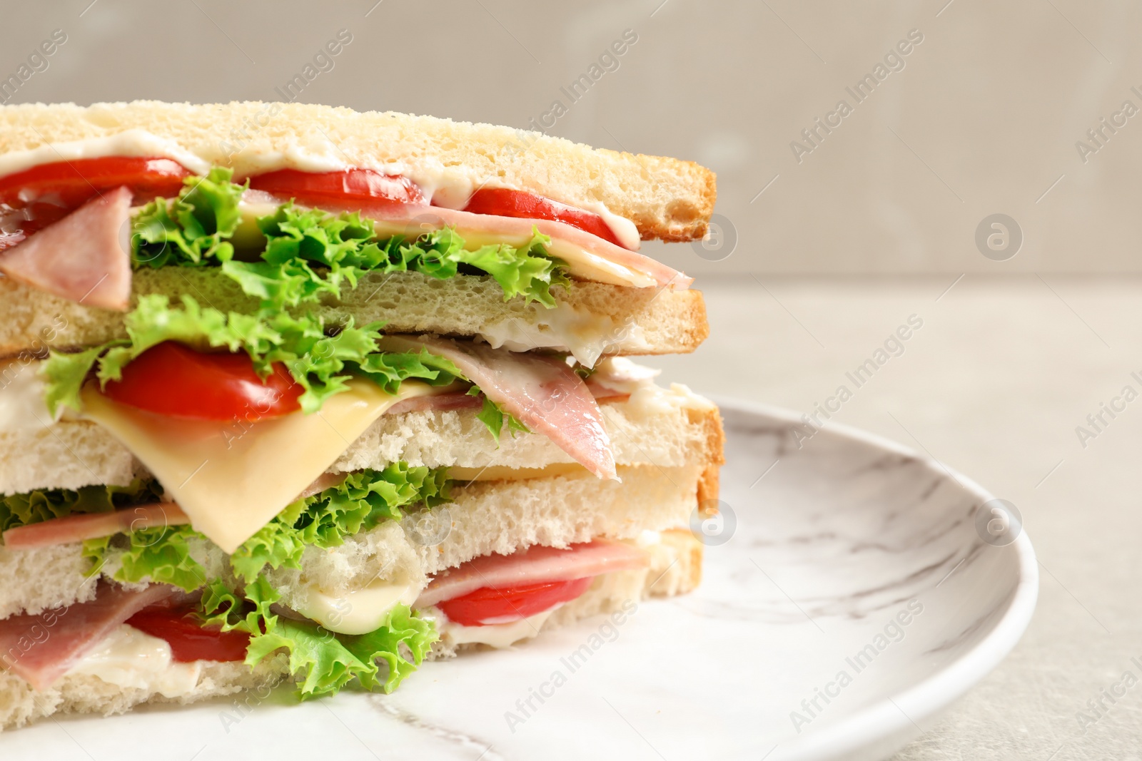 Photo of Tasty toast sandwich on plate, closeup. Wheat bread