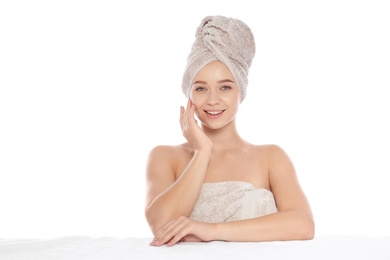 Photo of Portrait of young pretty woman with towels on white background