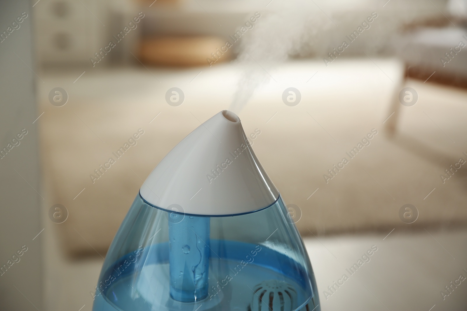 Photo of Modern humidifier indoors, closeup view. Home appliance