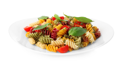 Photo of Colorful pasta with basil and cherry tomatoes isolated on white