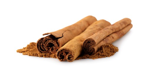 Dry aromatic cinnamon sticks and powder isolated on white