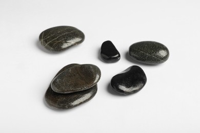 Group of different stones on white background