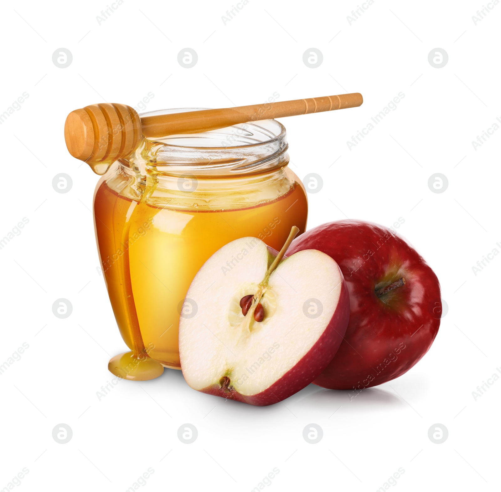 Image of Honey in glass jar, apples and dipper isolated on white