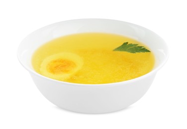 Photo of Delicious bouillon with egg and parsley in bowl on white background