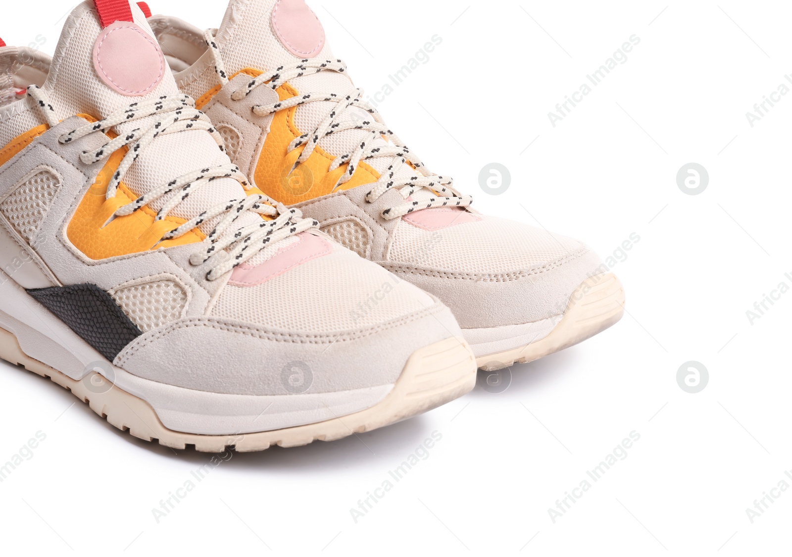 Photo of Pair of sports shoes on white background, closeup