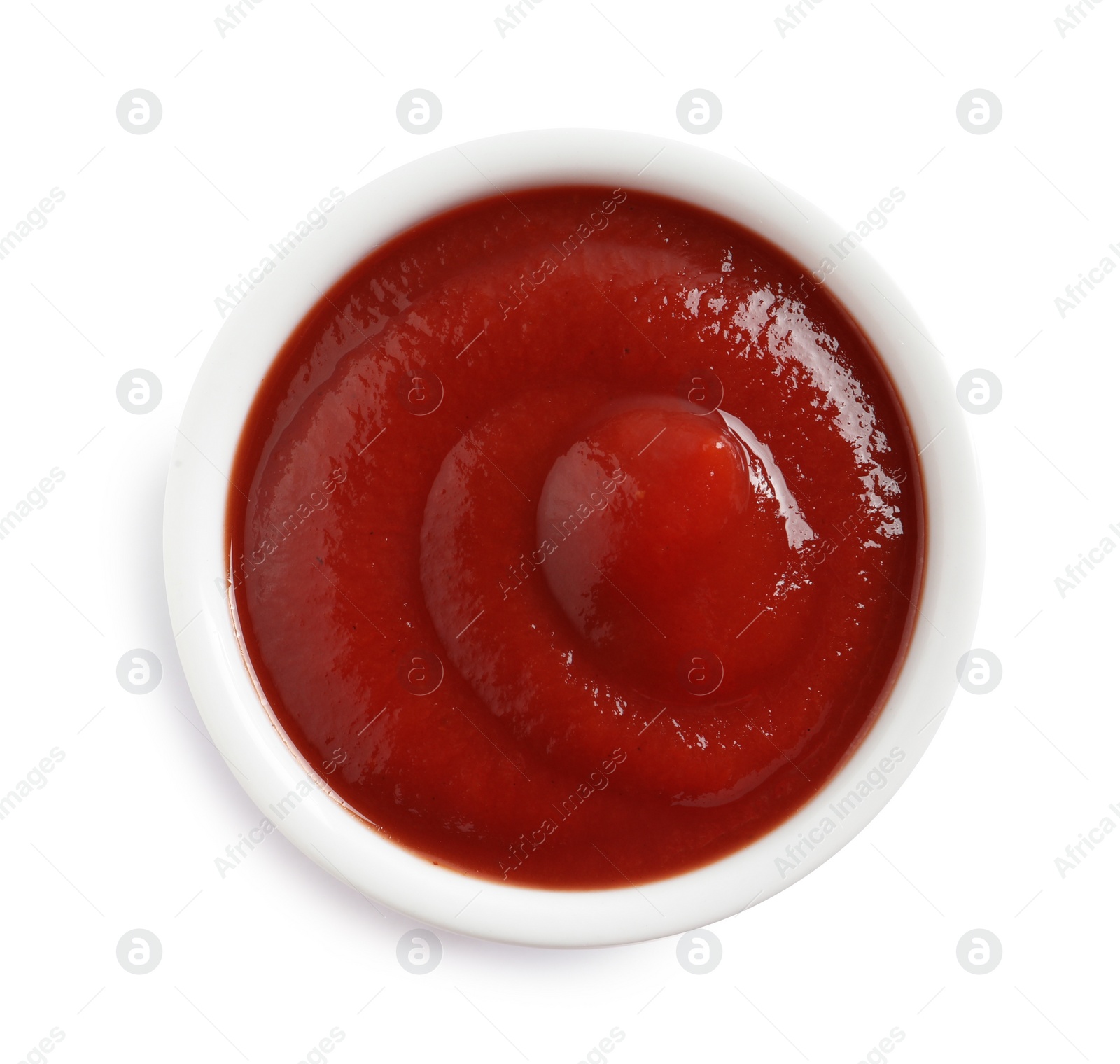 Photo of Delicious tomato sauce in bowl on white background, top view