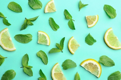 Fresh mint with sliced lemon on turquoise background, flat lay