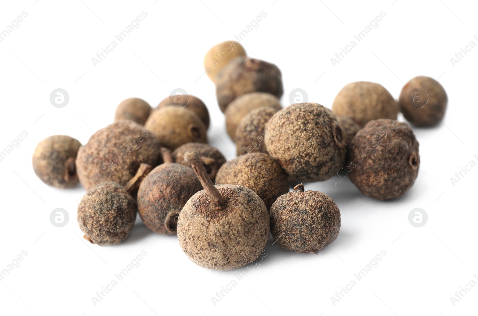 Photo of Heap of black pepper grains isolated on white