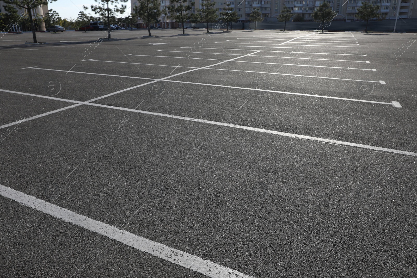 Photo of Car parking lot with white marking outdoors