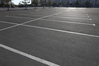 Car parking lot with white marking outdoors