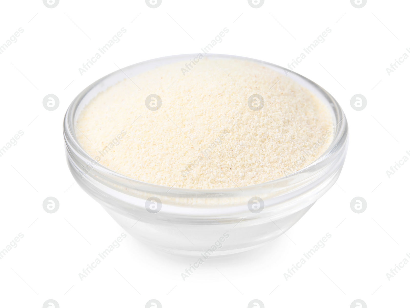 Photo of Bowl of uncooked organic semolina isolated on white