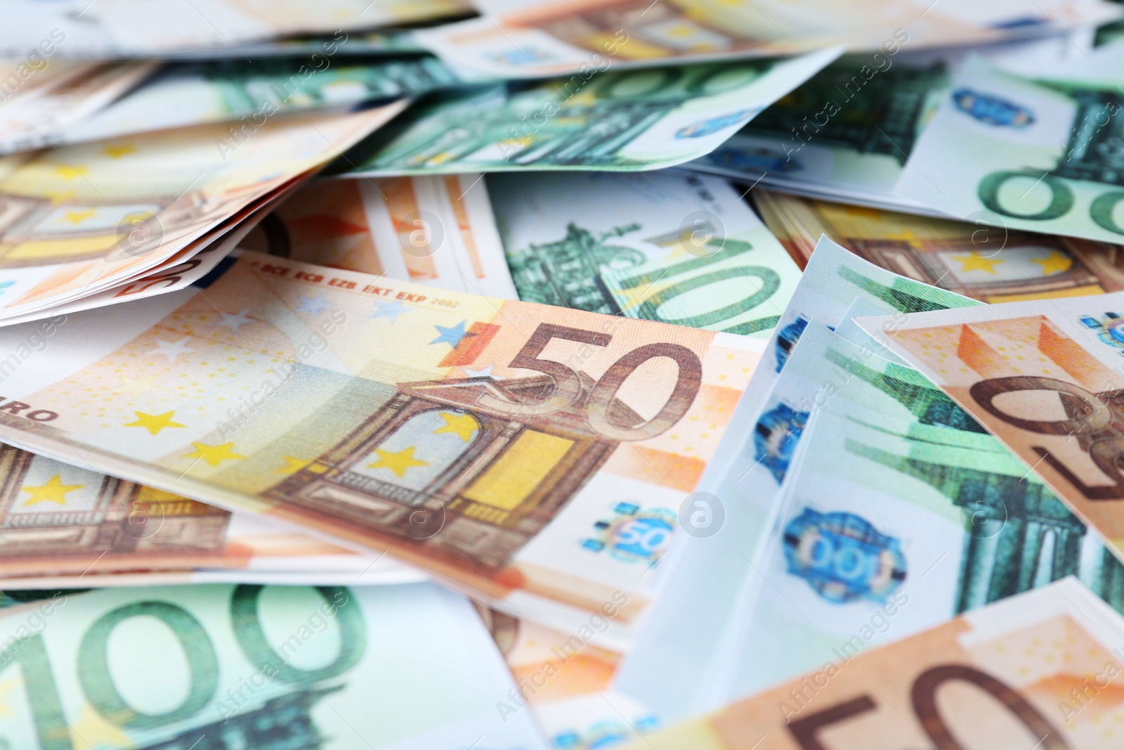 Photo of Different Euro banknotes as background, closeup. Money exchange