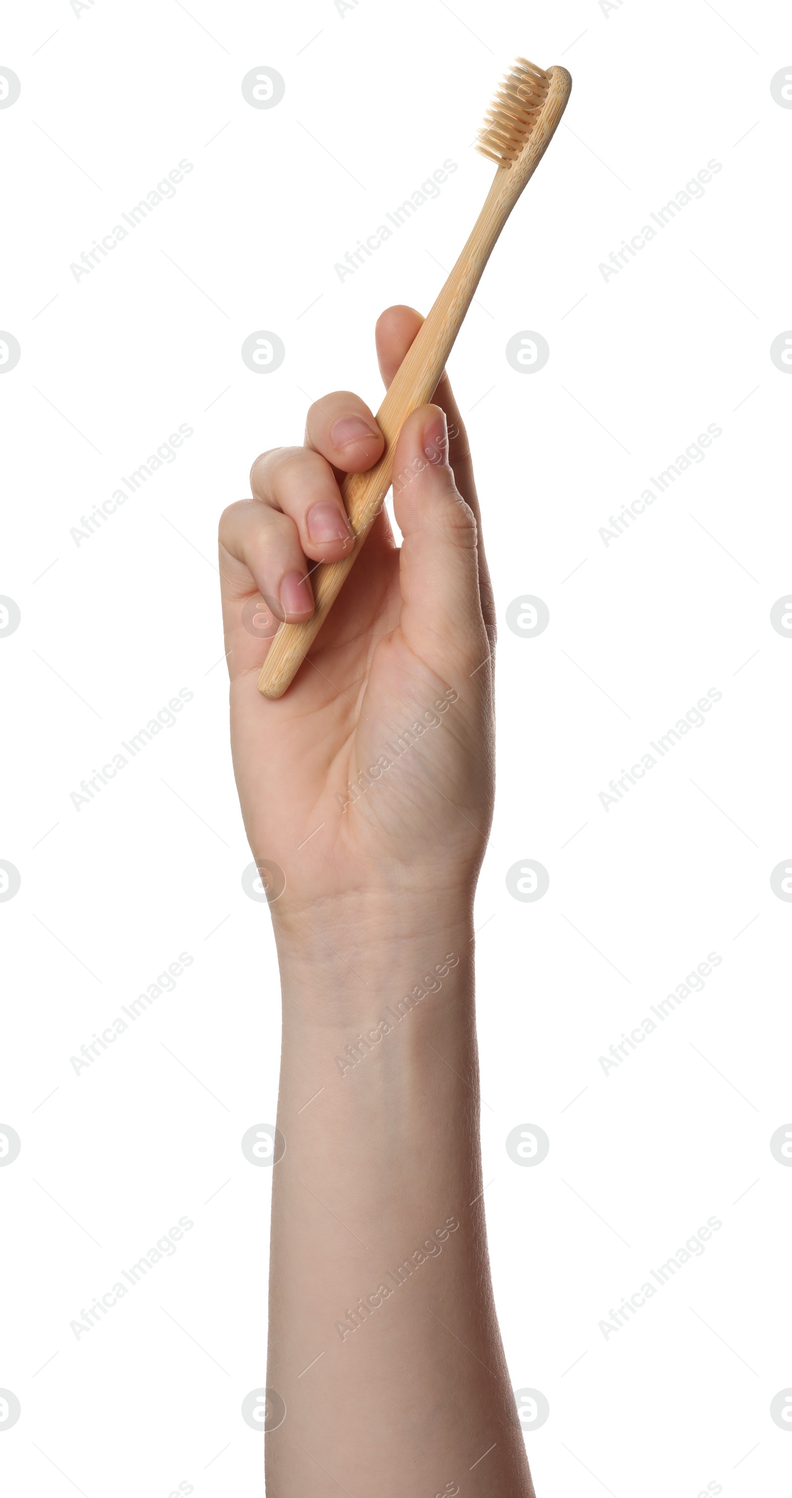 Photo of Woman holding eco friendly bamboo toothbrush on white background, closeup. Conscious consumption