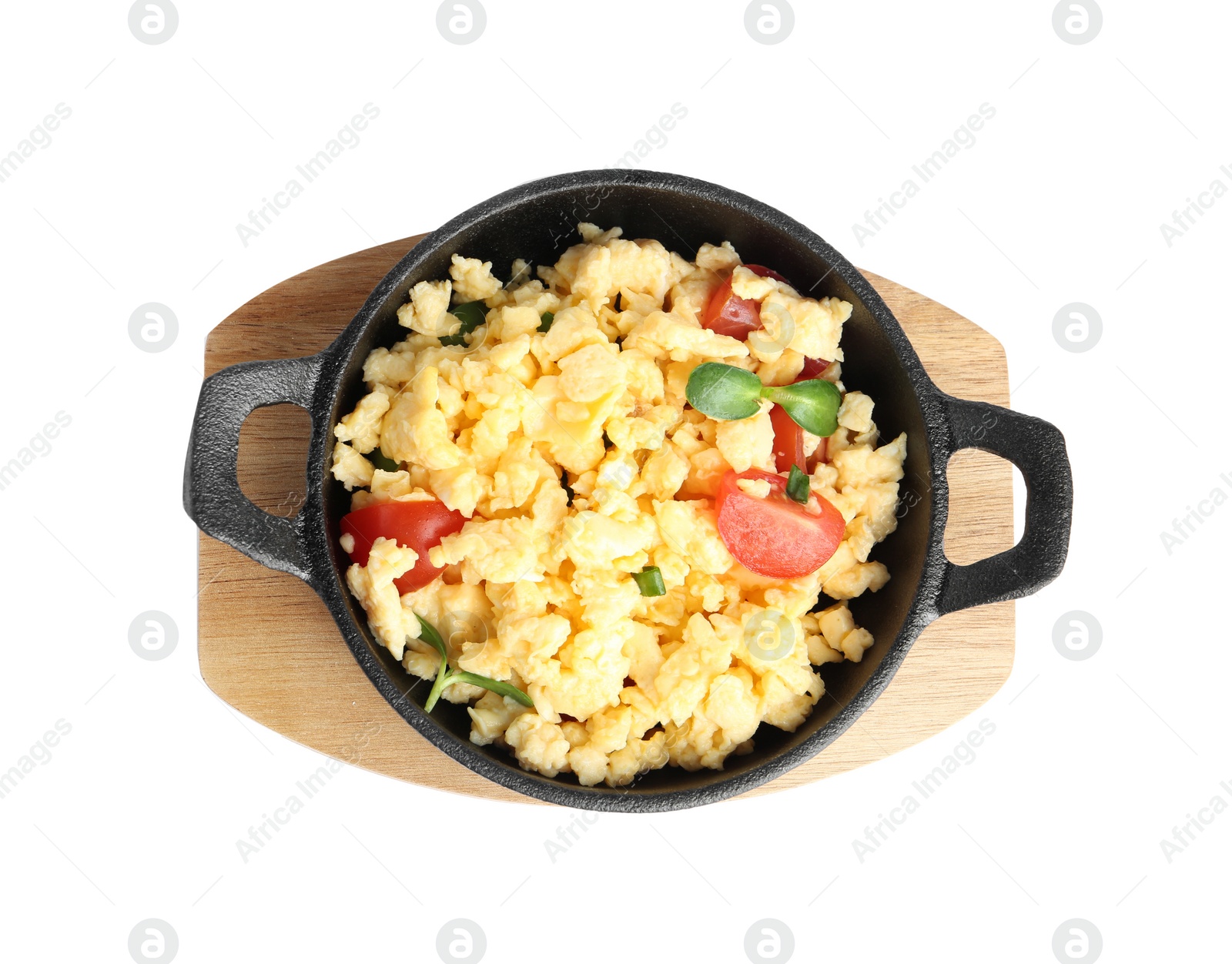 Photo of Tasty scrambled eggs with sprouts and cherry tomato in frying pan isolated on white, top view