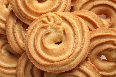 Photo of Delicious Danish butter cookies as background, closeup