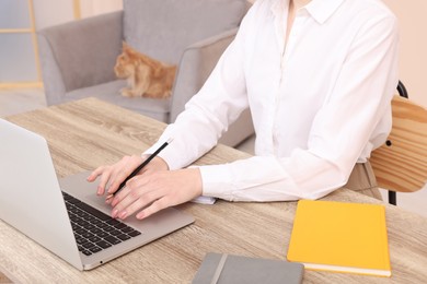 Woman working at desk, closeup. Home office