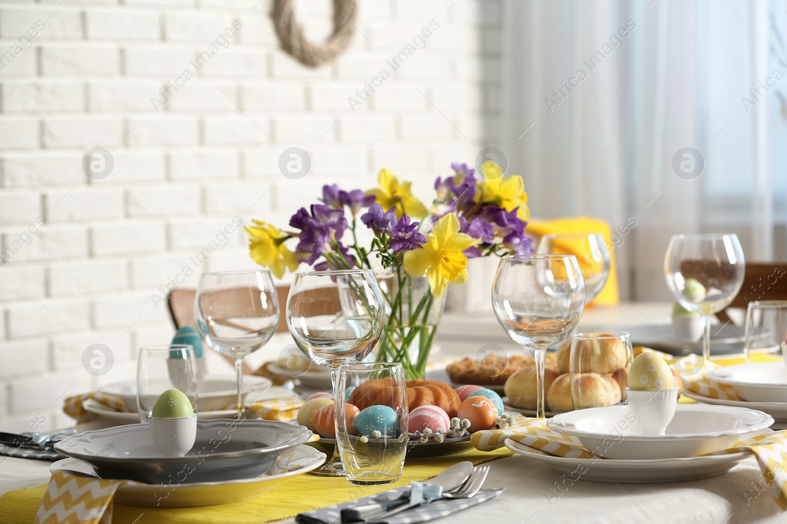 Photo of Festive Easter table setting with traditional meal at home