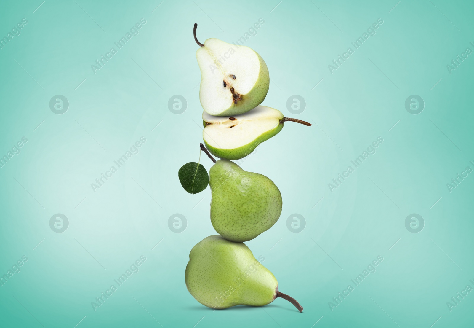 Image of Cut and whole fresh ripe pears on turquoise gradient background