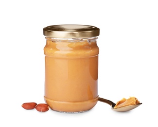 Photo of Jar and spoon with creamy peanut butter on white background