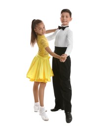 Beautifully dressed couple of kids dancing on white background