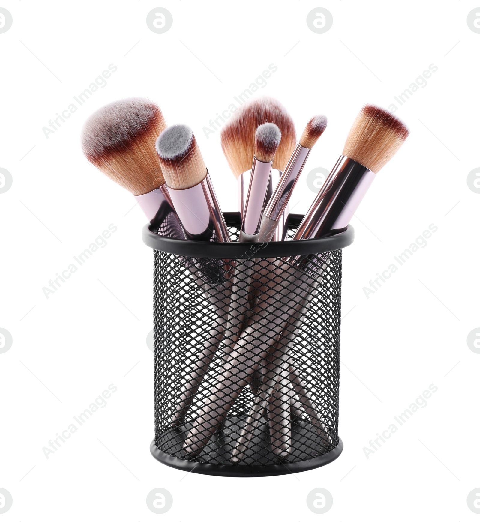 Photo of Set of professional makeup brushes in black holder isolated on white