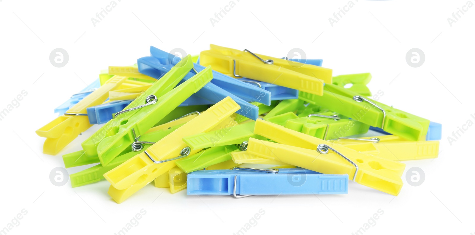 Photo of Many colorful plastic clothespins on white background