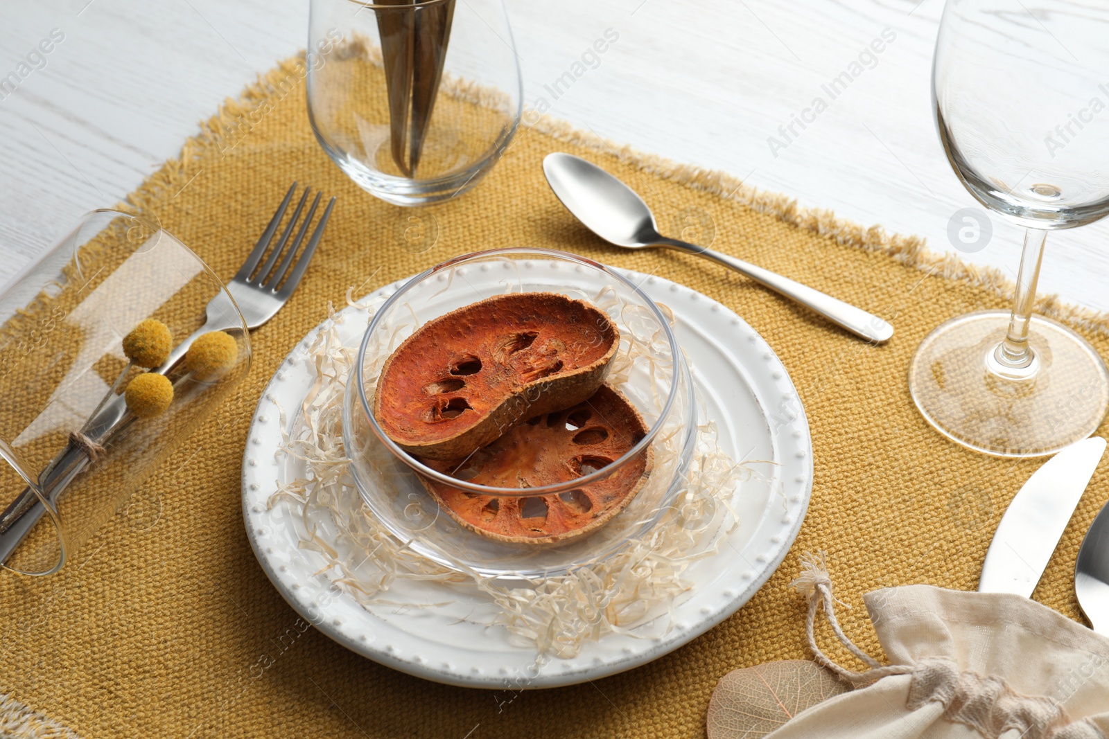 Photo of Autumn table setting with dried pumpkin slices on white background