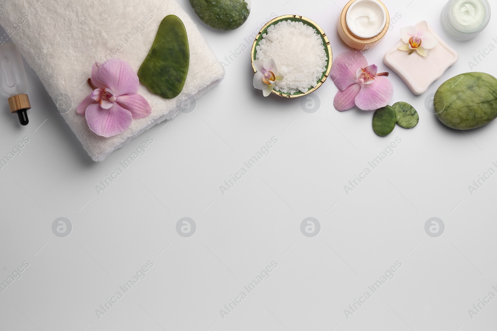 Photo of Flat lay composition with different spa products on white background. Space for text