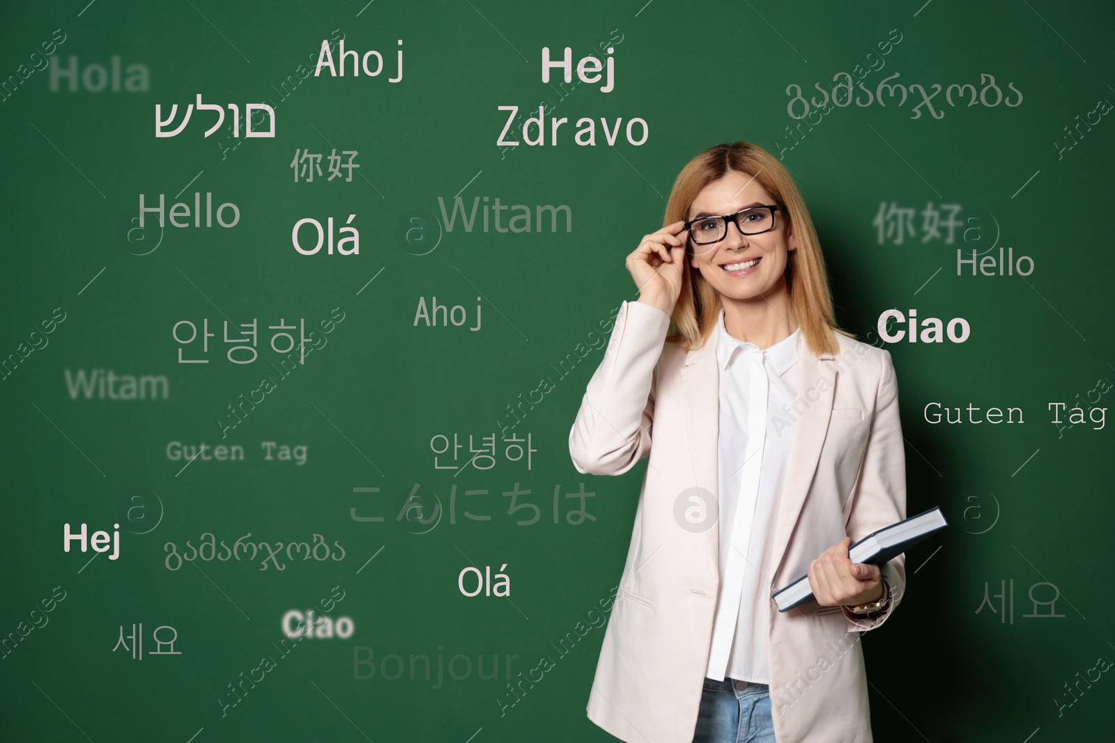 Image of Portrait of happy translator and greeting words in different foreign languages on green background