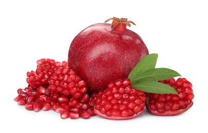 Photo of Tasty ripe pomegranates and leaves on white background